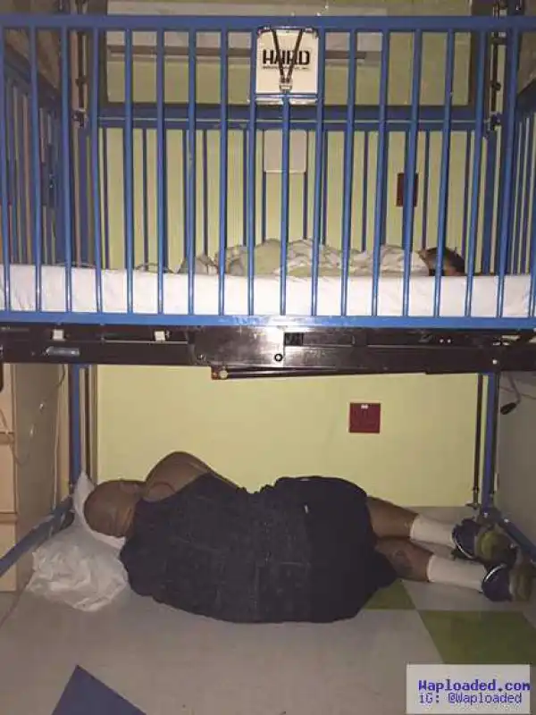 Touching photo of a father sleeping under sick son